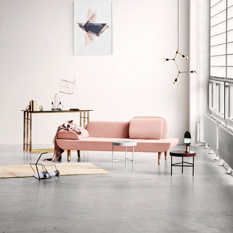 Modern living room with pink sofa.
