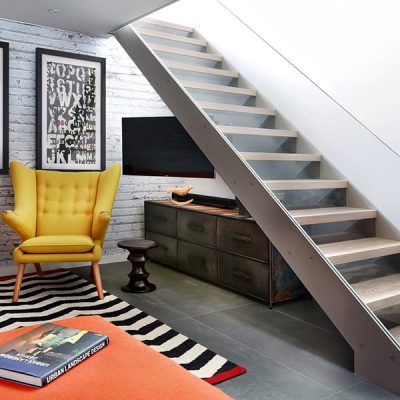 Modern living room with yellow armchair.