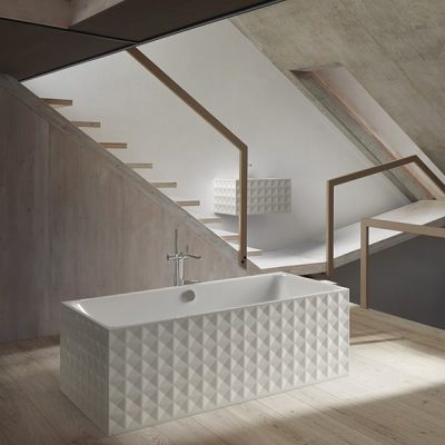 Modern bathroom with geometric bathtub design.