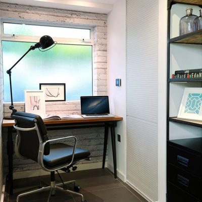 Modern home office with desk and chair.