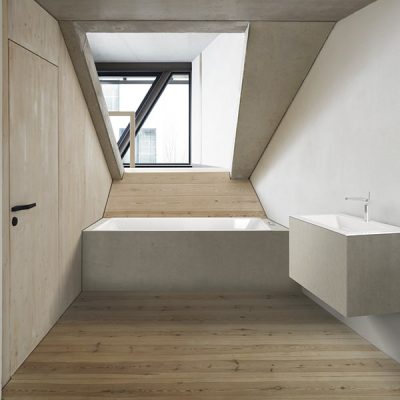 Minimalist bathroom with wooden and concrete design.