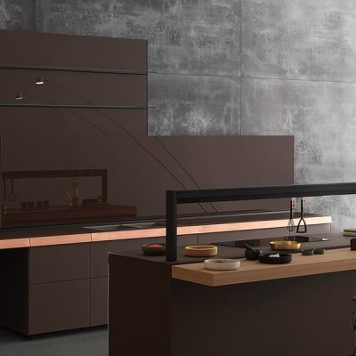 Modern minimalist kitchen with dark tones.