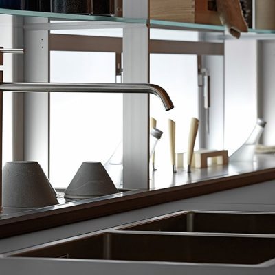 Modern kitchen sink with sleek faucet design.