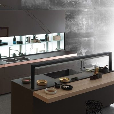 Modern kitchen with sleek dark design.