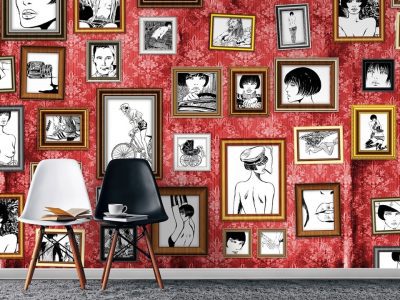 Chairs against red wall with framed illustrations.