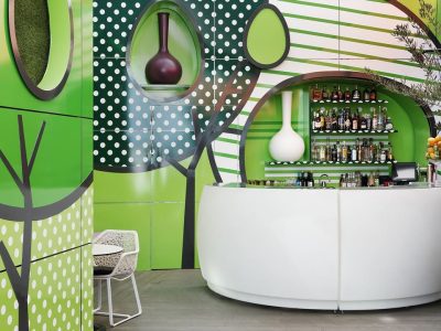 Colorful bar with green, polka dot walls.