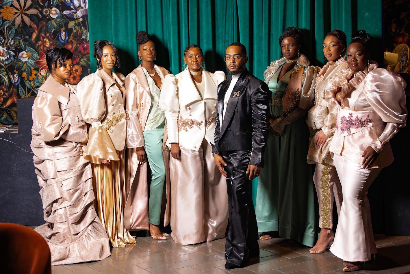 Group in elegant formal attire, posing together.