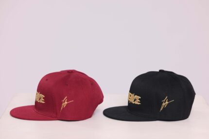 Red and black embroidered baseball caps.
