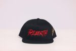 Black cap with "Rebirth" embroidered in red.