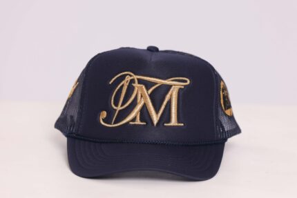 Navy cap with gold embroidered initials.