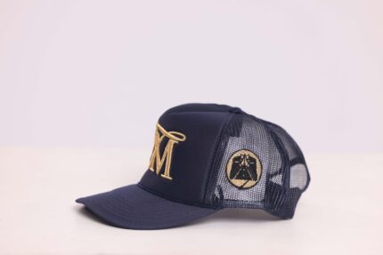 Blue cap with gold embroidery on side.