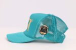 Teal mesh cap with gold emblem.