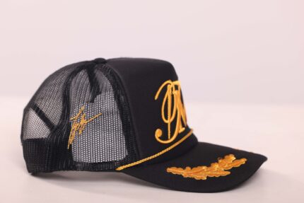 Black mesh cap with gold embroidery details.
