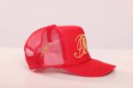 Red mesh cap with gold embroidery.