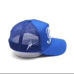 Blue mesh trucker cap with a white 'L' logo on the front.